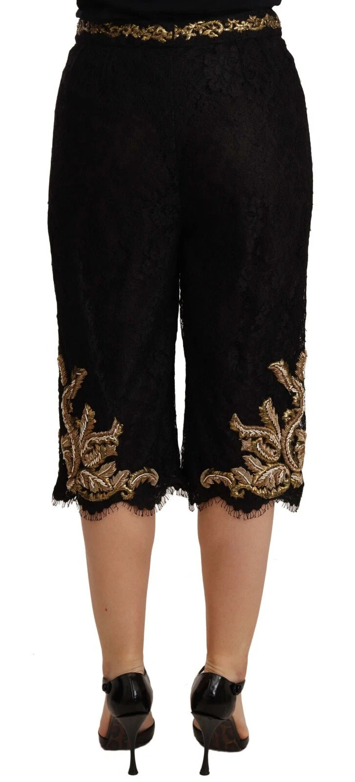 A pair of black lace shorts with gold baroque embroidery
