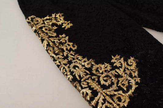 A black lace garment with gold baroque embroidery on the front