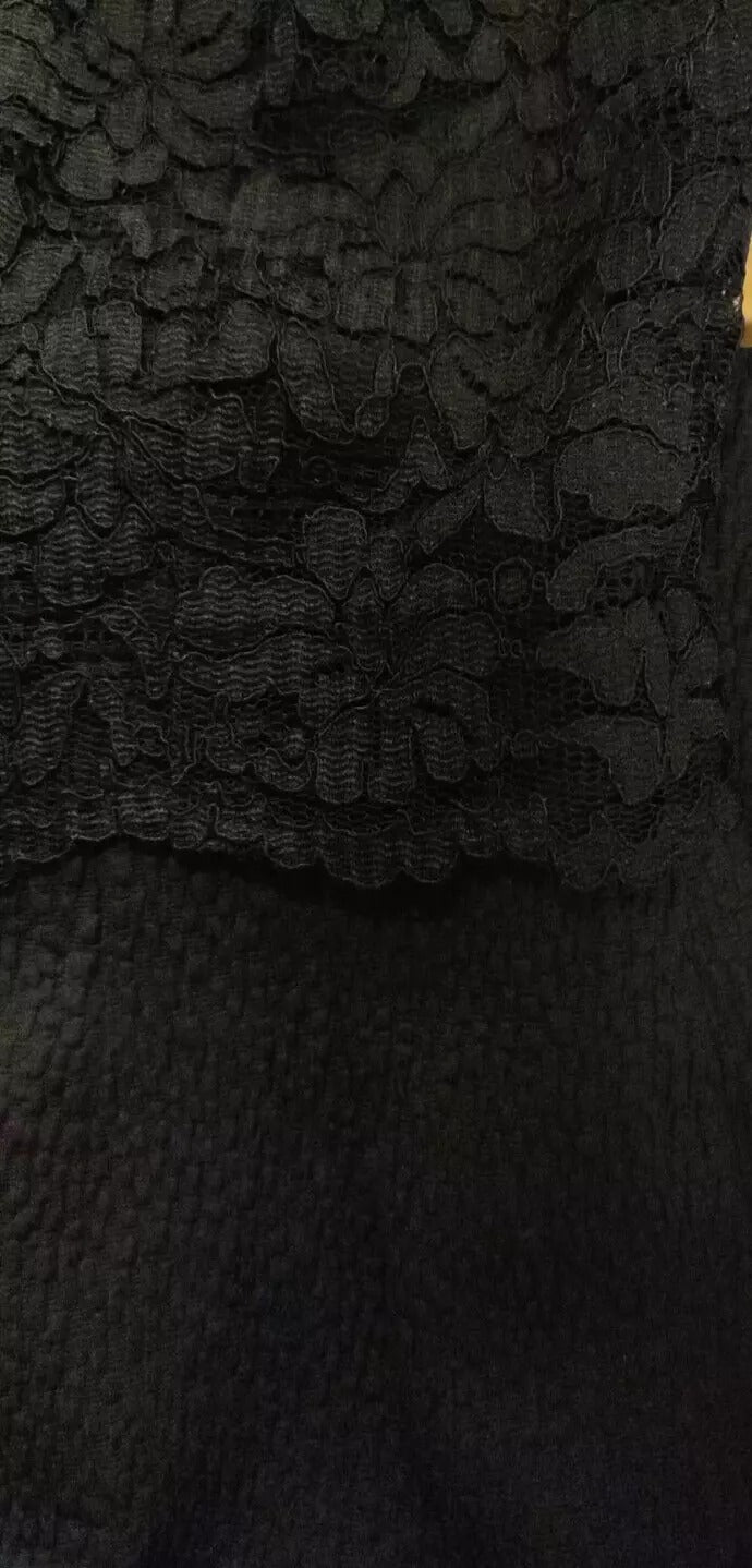 A black lace bodycon sheath dress by Dolce & Gabbana