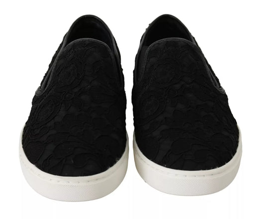 Pair of black lace-up slip-on shoes with white soles and a logo on the side