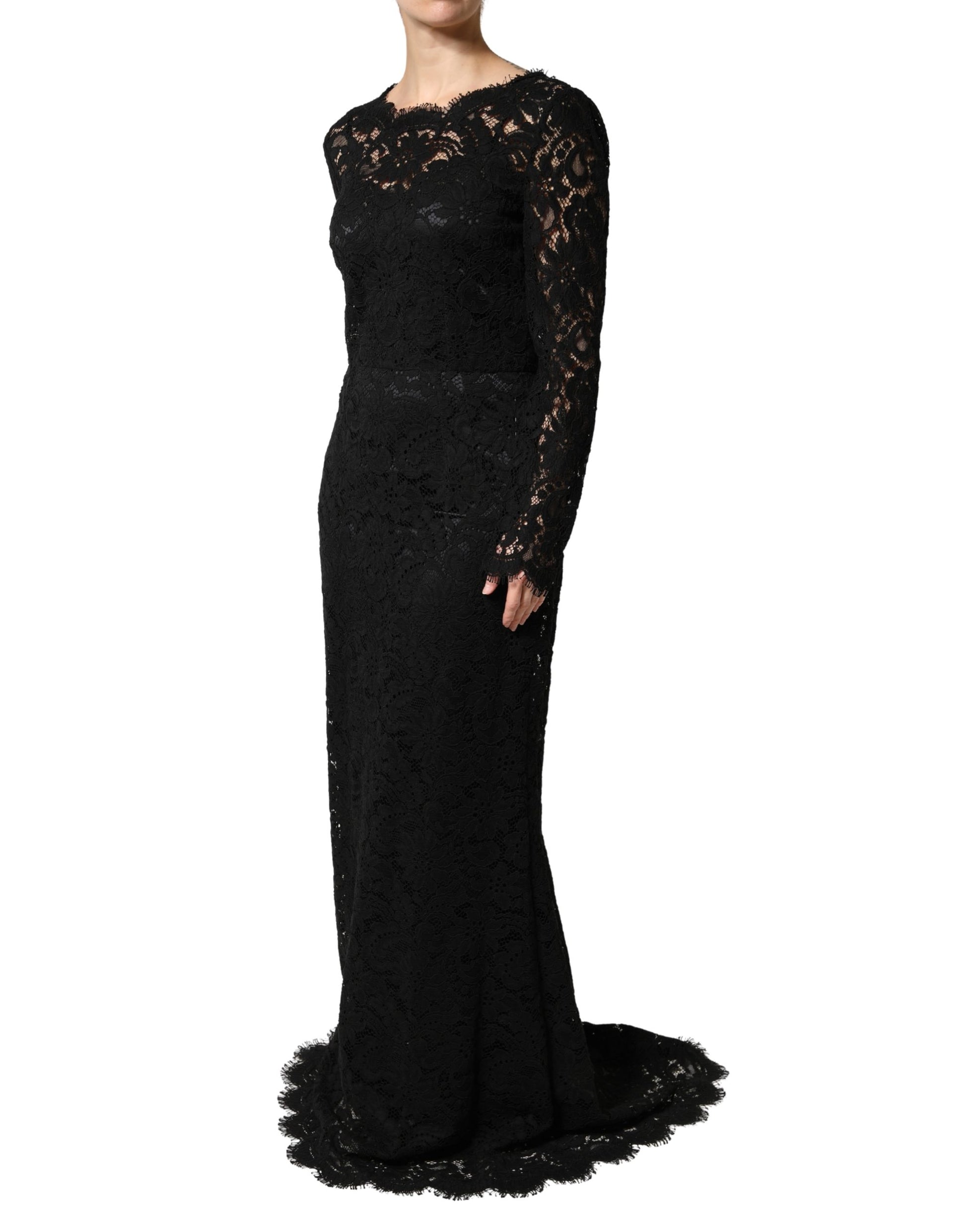 A long black lace dress with long sleeves and a train, designed by Dolce & Gabbana