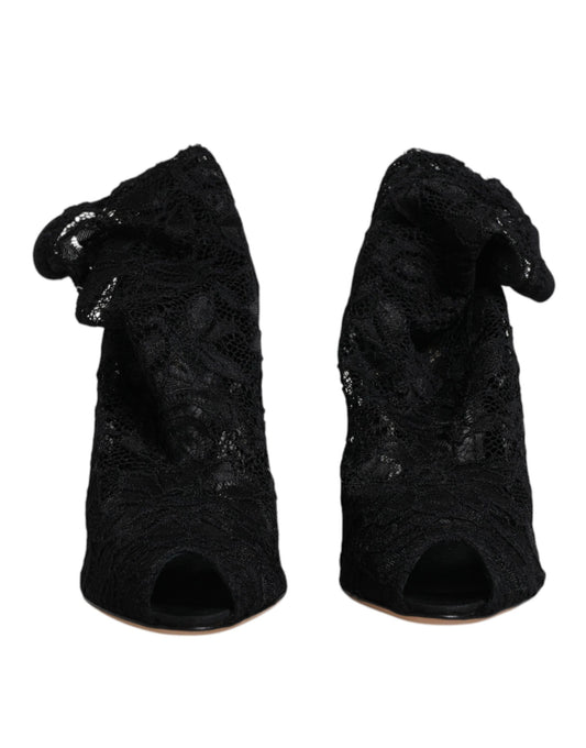 Pair of black velvet ankle boots with embellishments