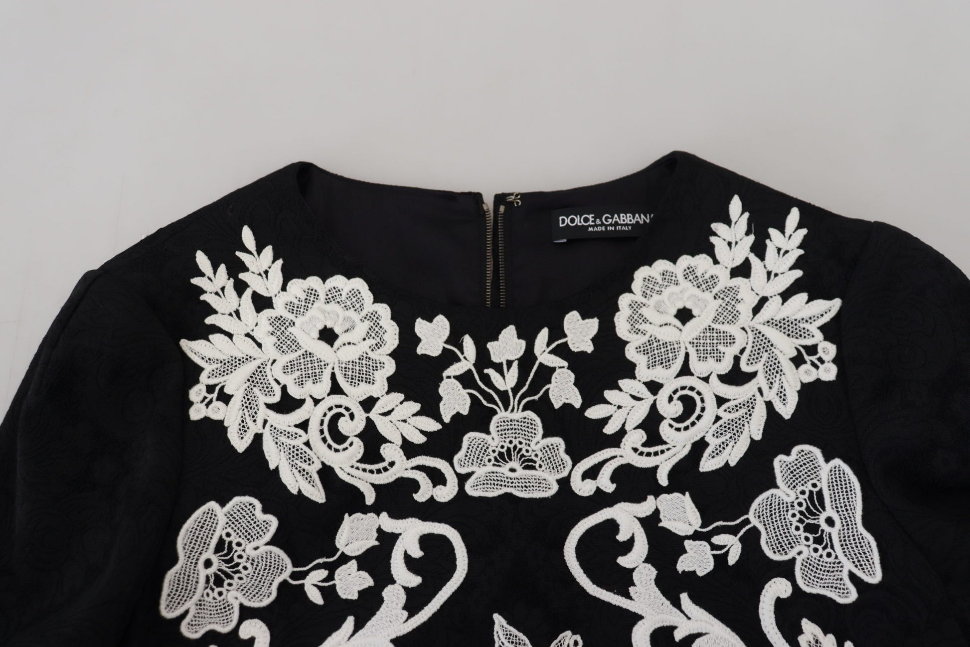 Black lace trimmed dress with half sleeves and a-line silhouette