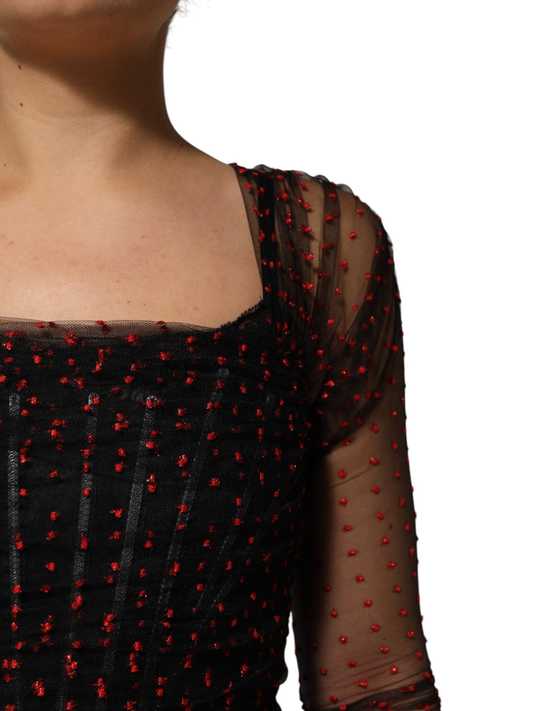 A black lace trim long sleeve sheath mini dress with red beads