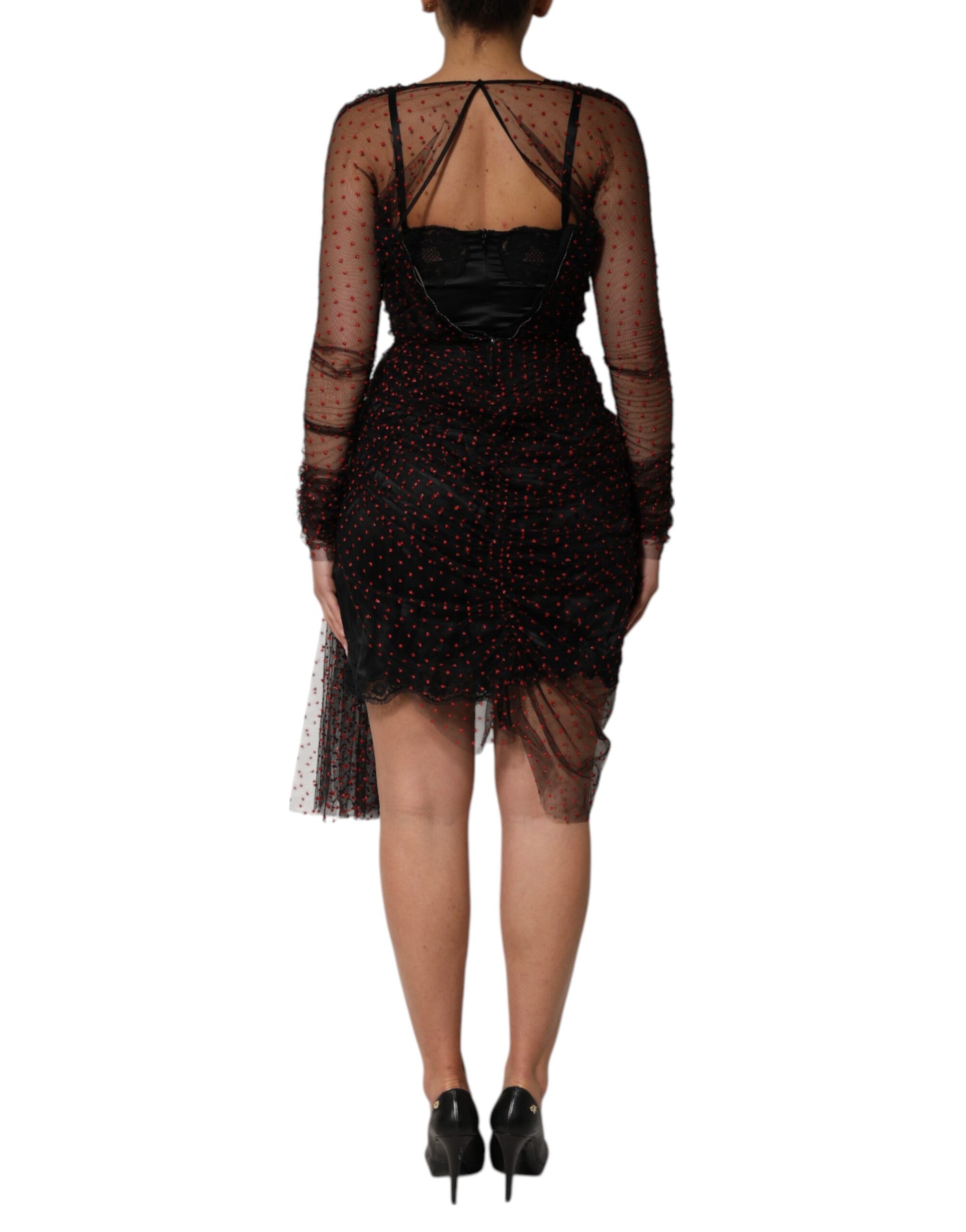 A black lace trim long sleeve sheath mini dress with a high neckline