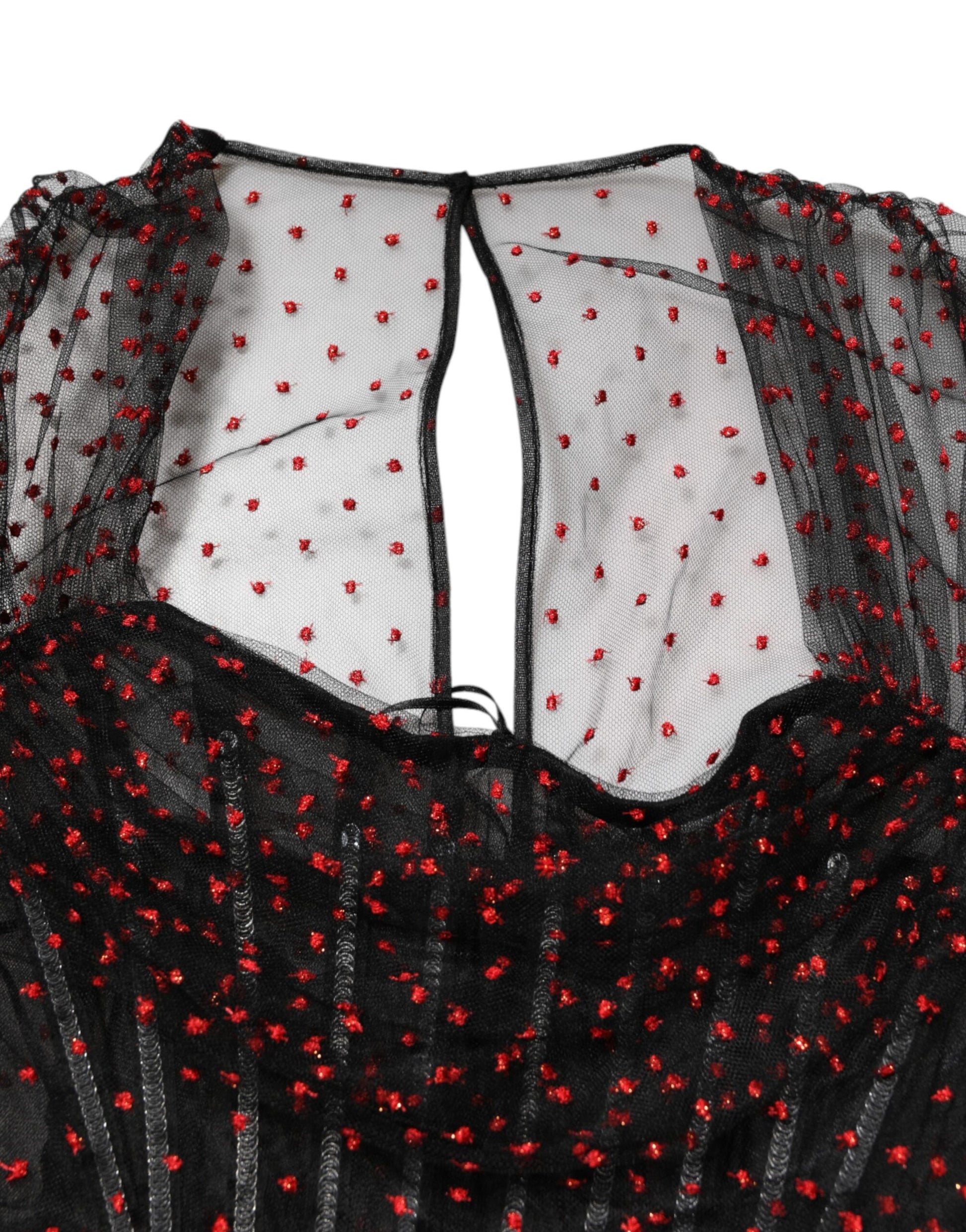 A black lace trim sheath dress with long sleeves and red sequins