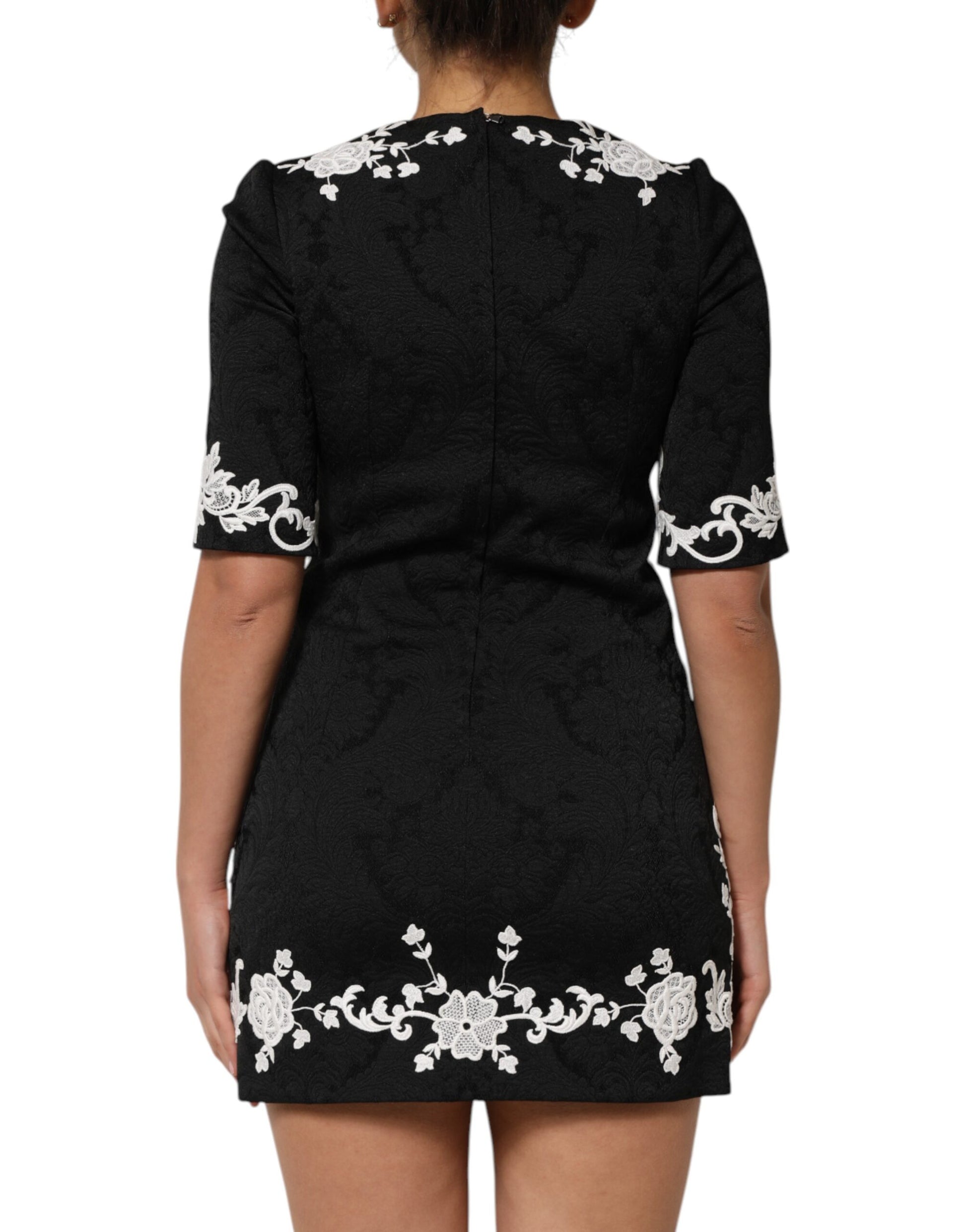 Black dress with white floral embroidery on back