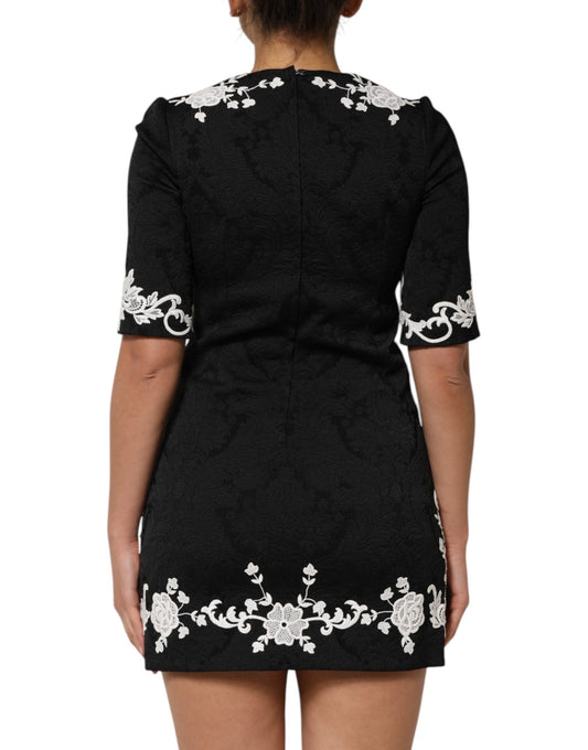 Black dress with white floral embroidery on back