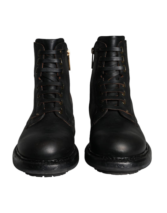 Pair of black leather boots with laces