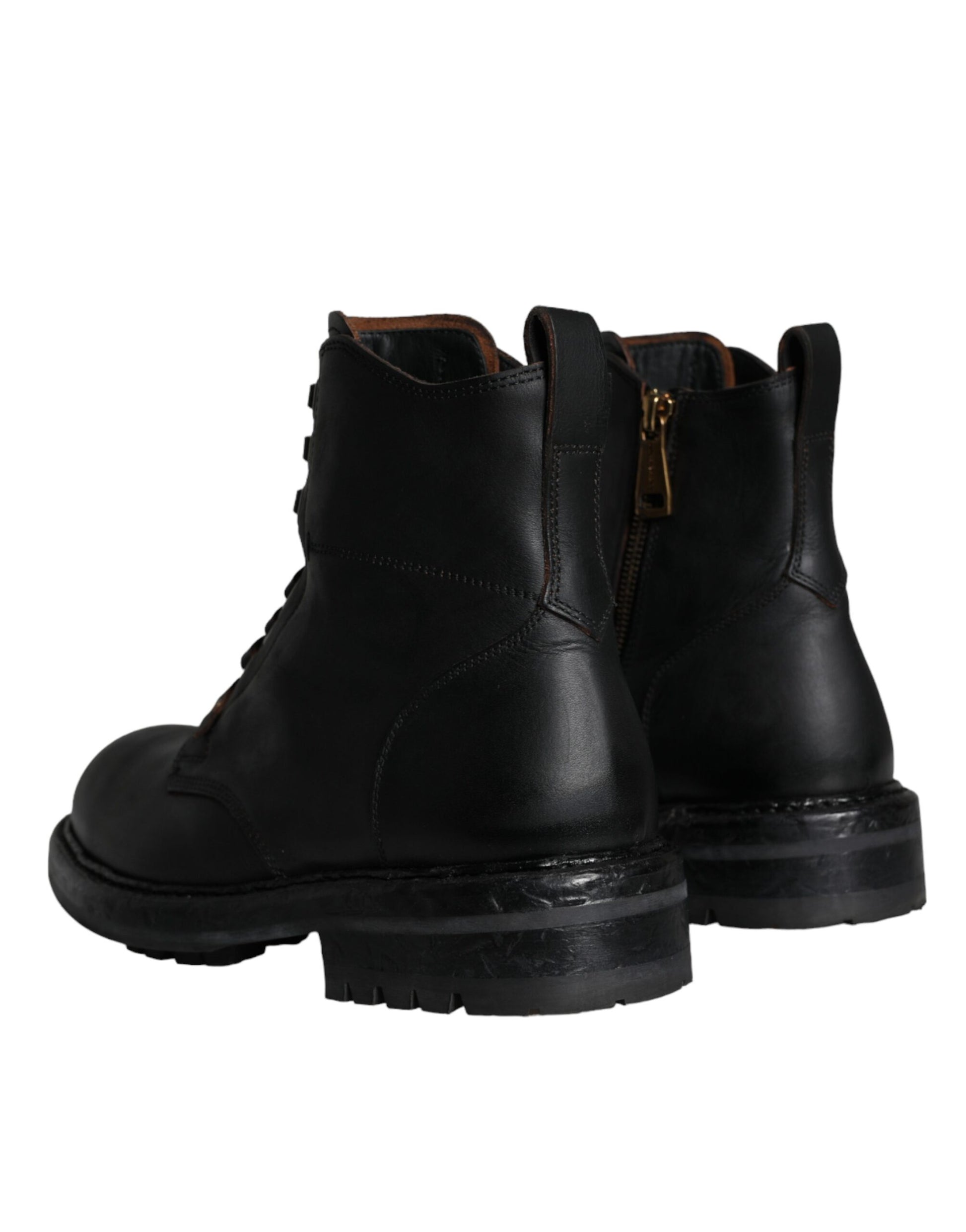 Pair of black leather boots with laces and a zipper on top