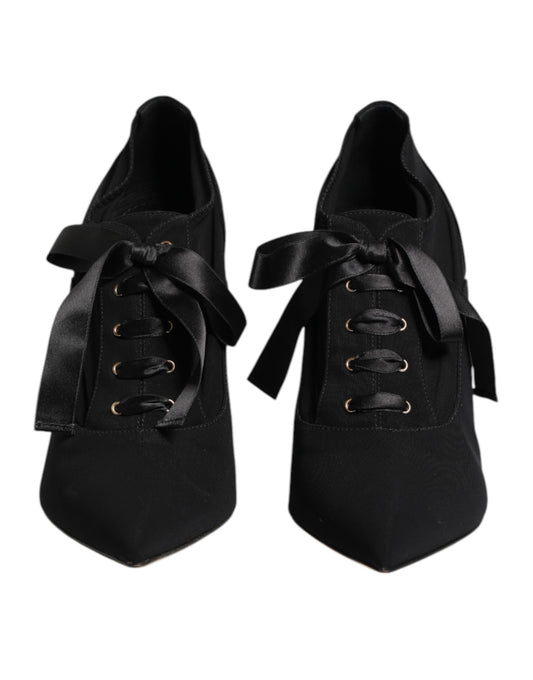 Pair of black ballet shoes with ribbon laces
