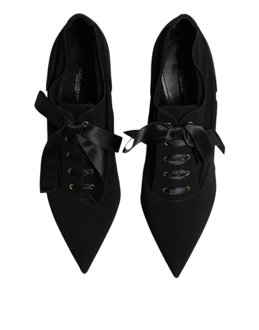 Pair of black women's shoes with bow detailing