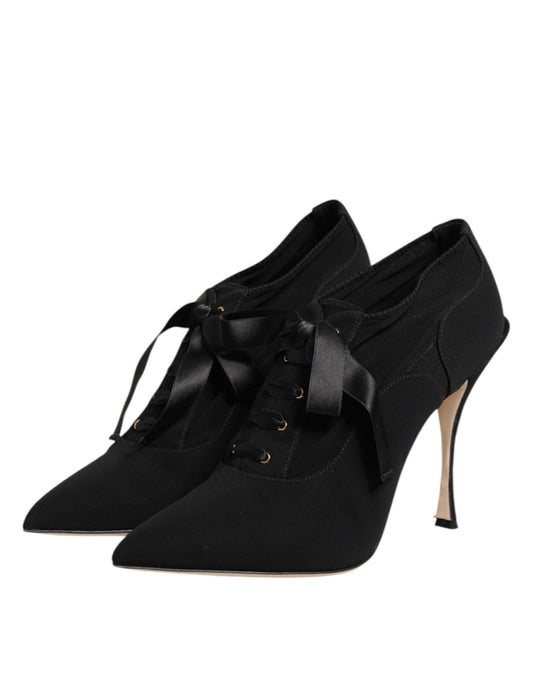 Pair of black women's dress shoes with bow detailing