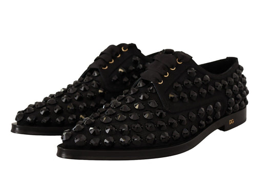 Pair of black shoes with studs and buckles
