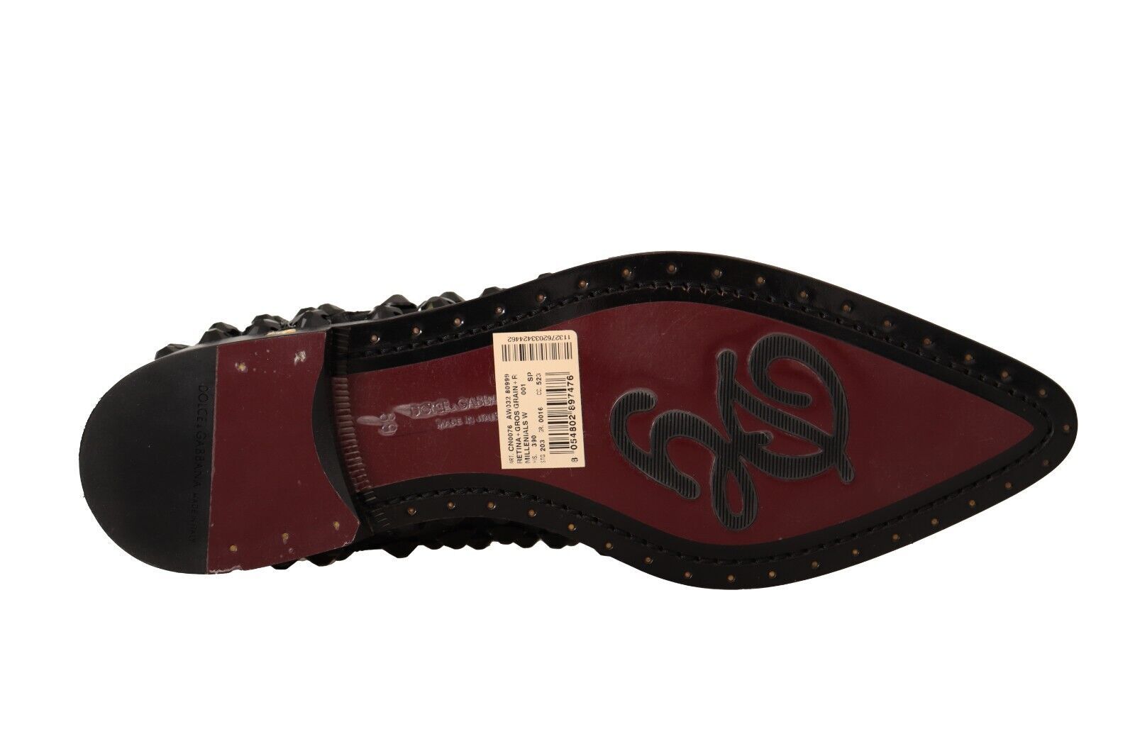 Red and black shoe with white tag