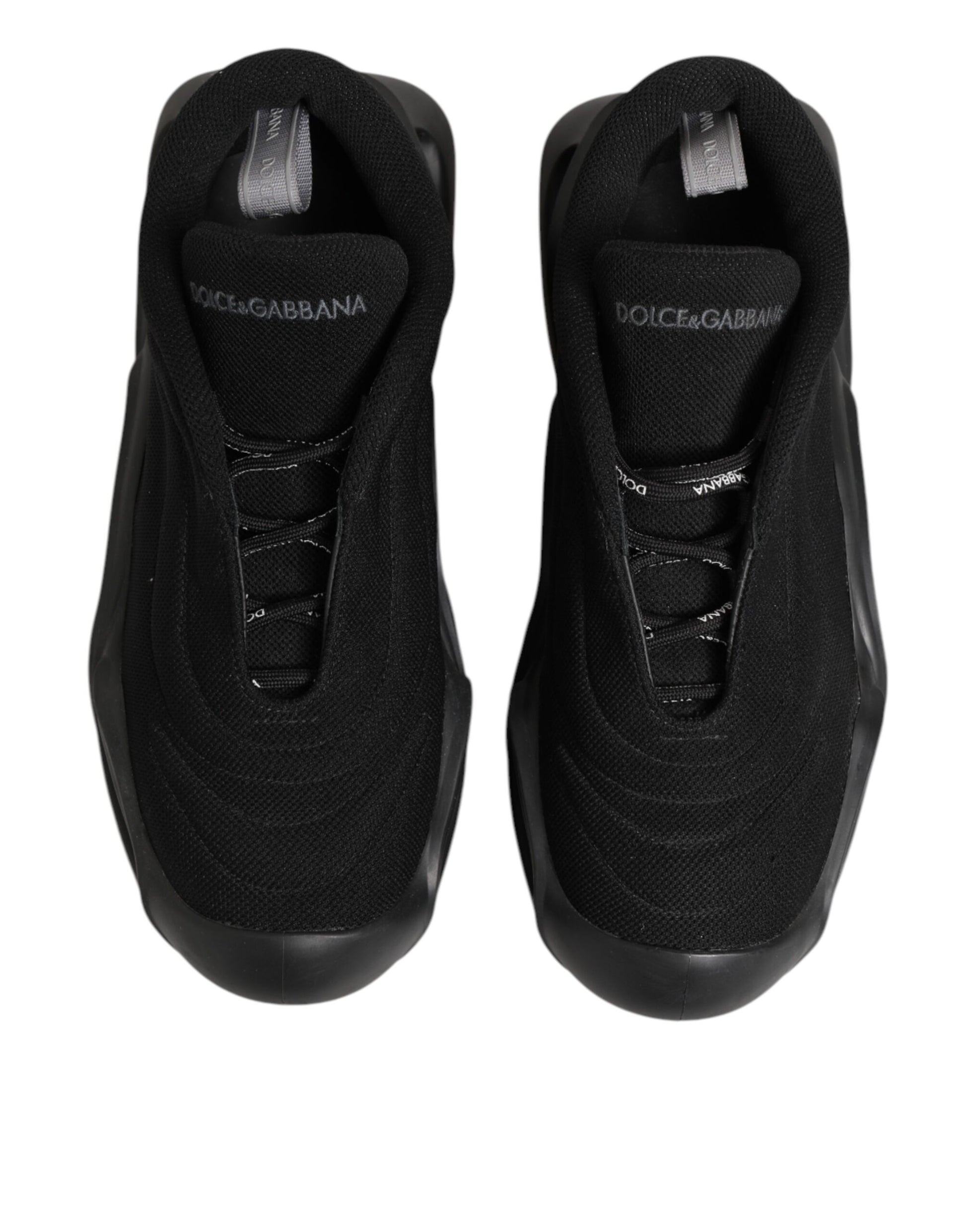 Pair of black lace-up sneakers with white logo on side, designed by Dolce & Gabbana