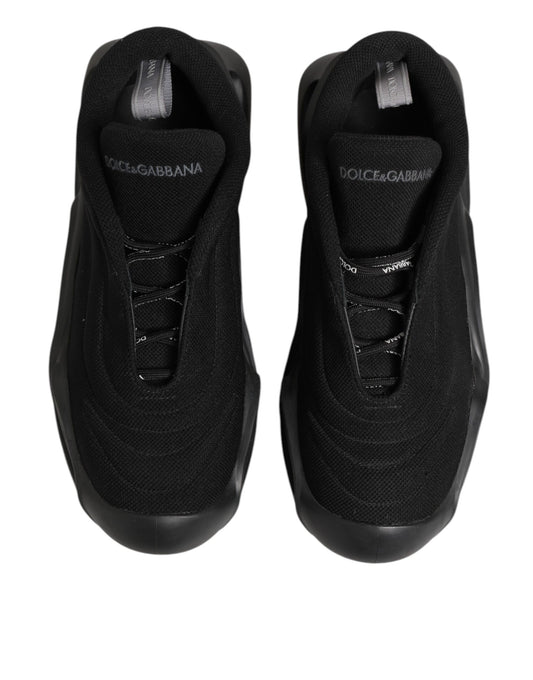 Pair of black lace-up sneakers with white logo on side, designed by Dolce & Gabbana