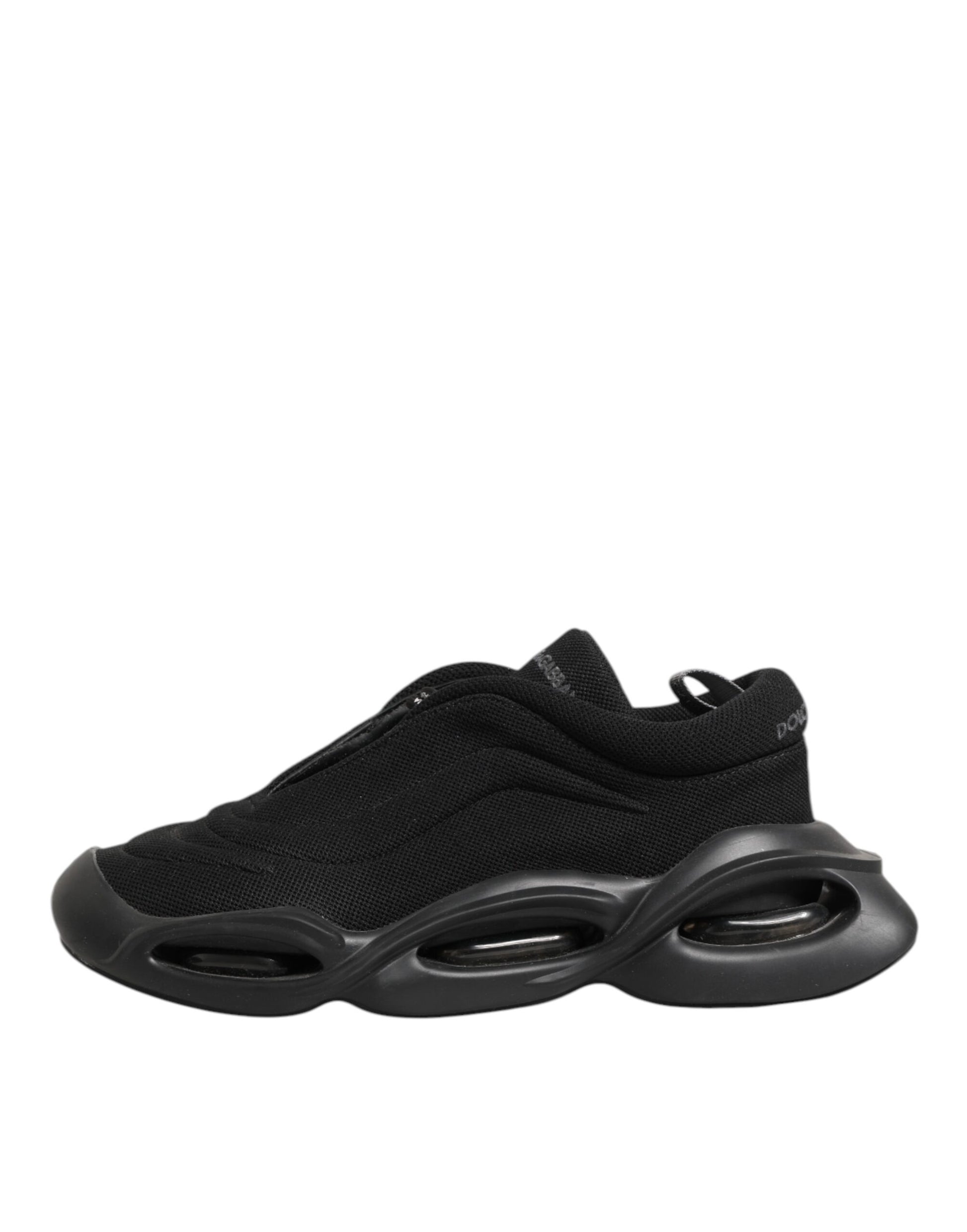 A black lace-up sneaker with a wave design on the sole
