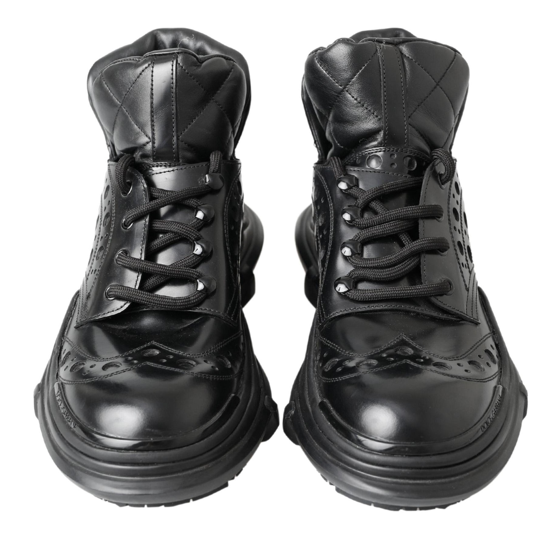 Pair of black leather boots with laces and a small heel
