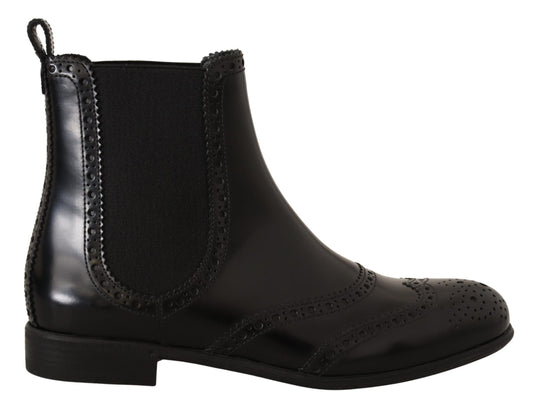 Black leather boot with lace closure and embroidered detailing