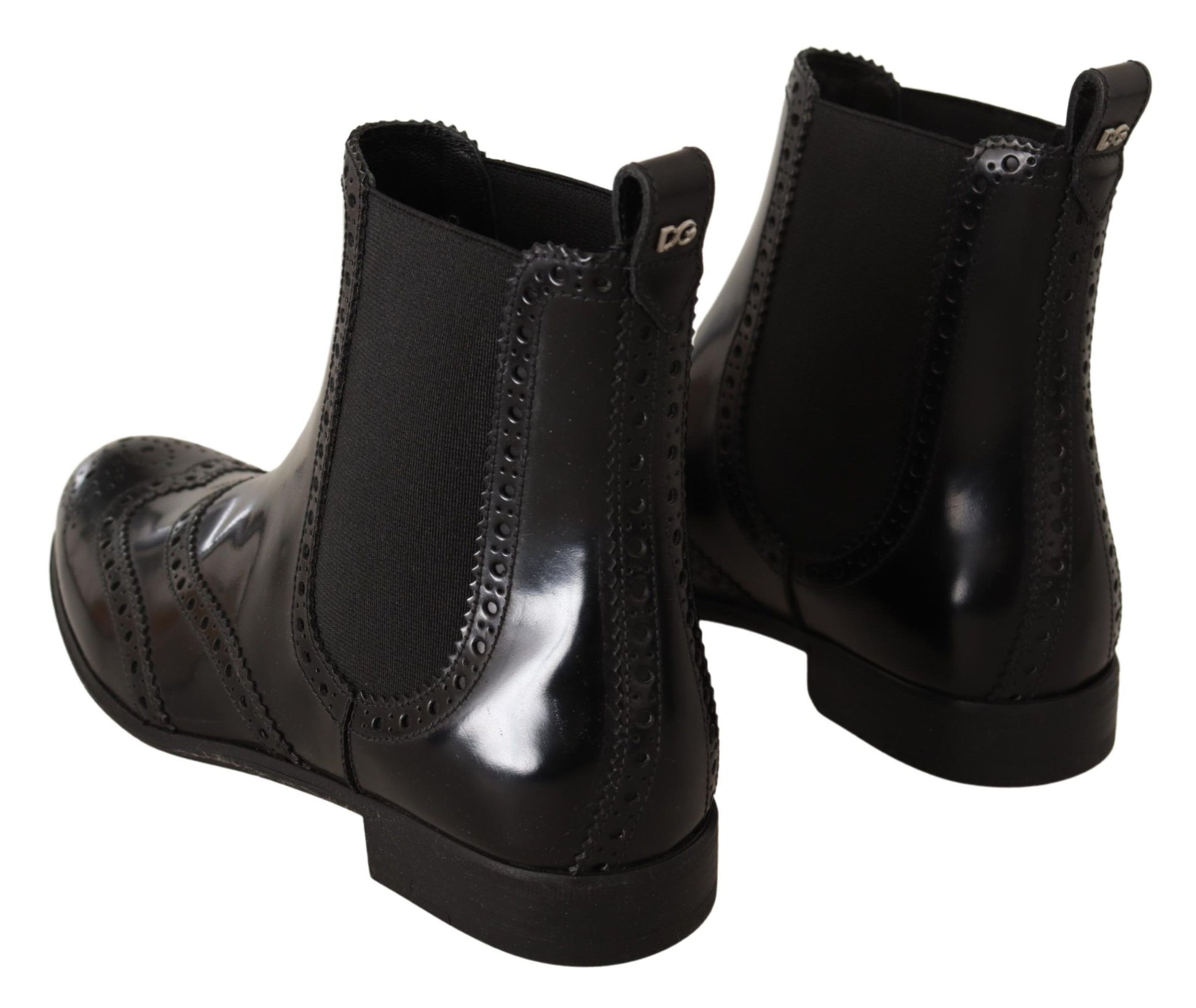 Pair of black leather boots with laces and a zipper on top