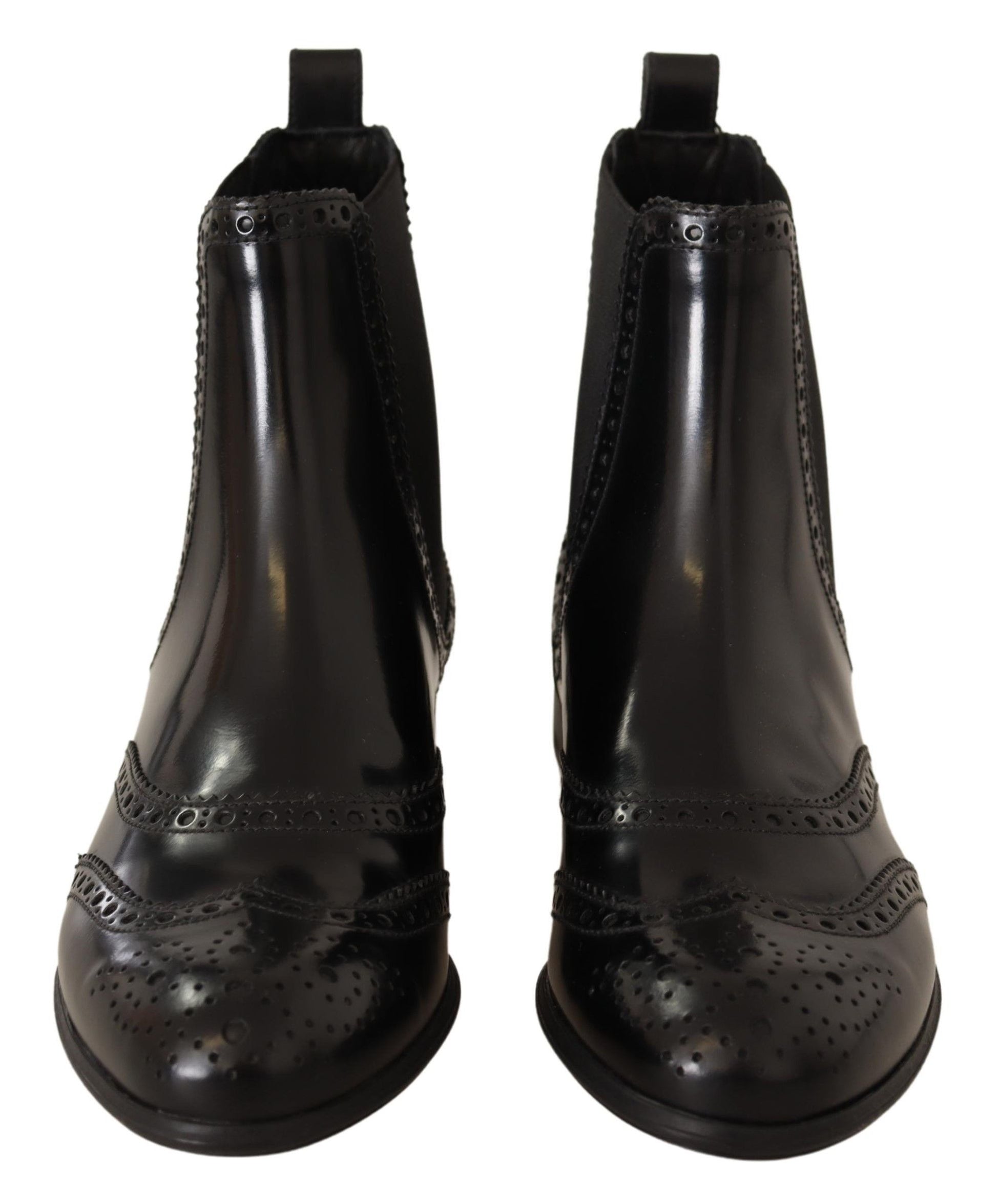 Pair of black leather boots with laces and decorative stitching