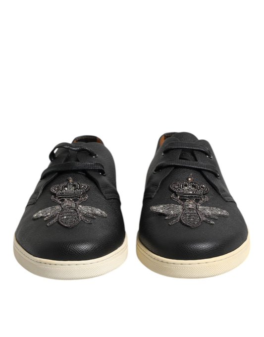 Pair of black shoes with gold accents
