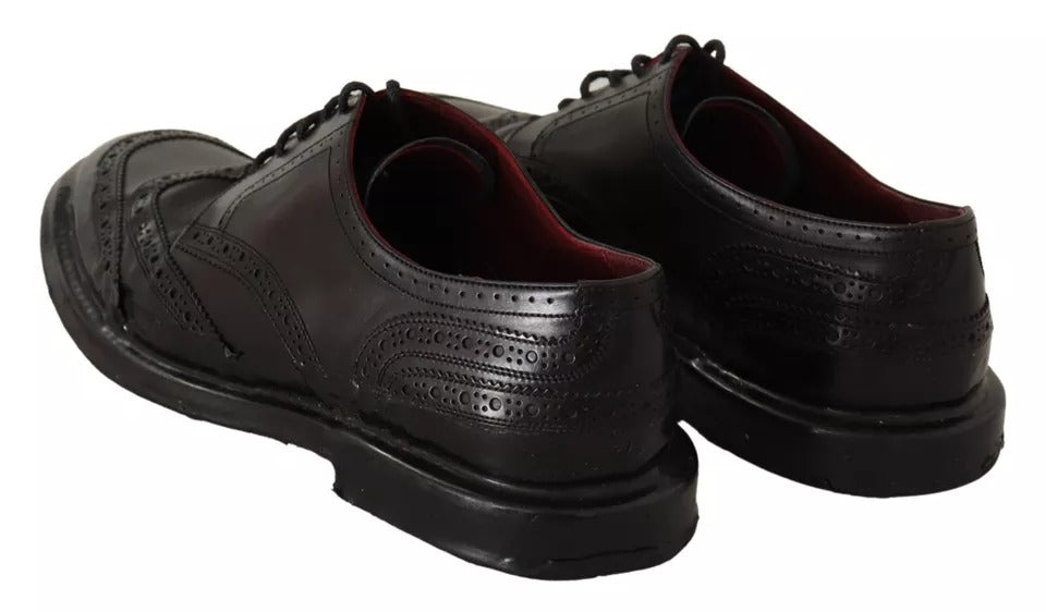 Pair of black leather brogue oxford dress shoes with laces and a small heel
