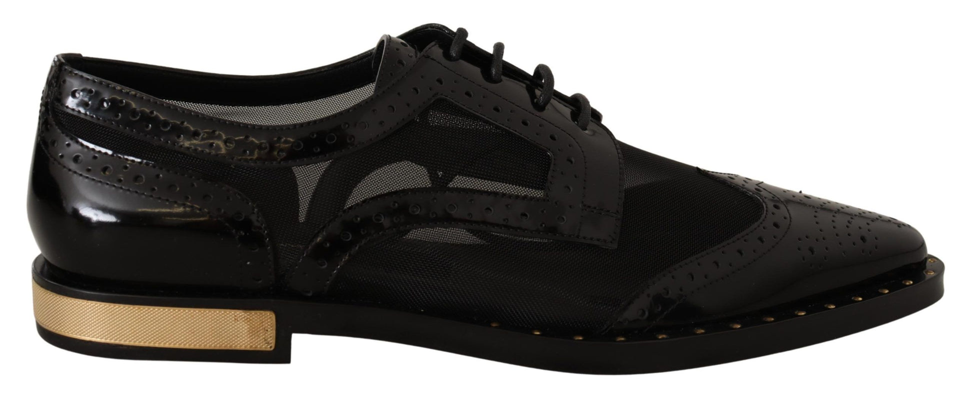 Pair of black dress shoes with gold accents and laces
