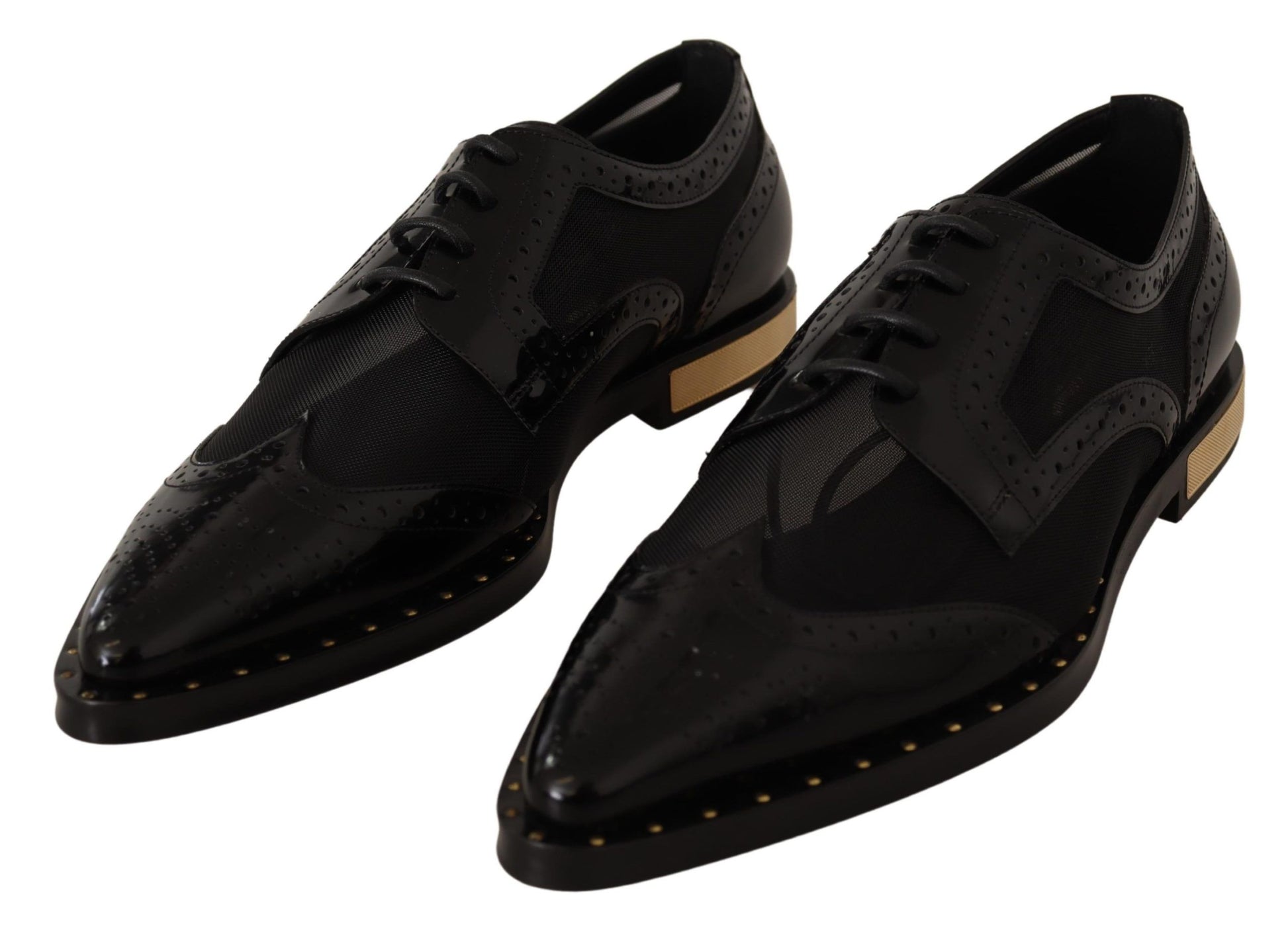 Pair of black dress shoes with gold accents and laces