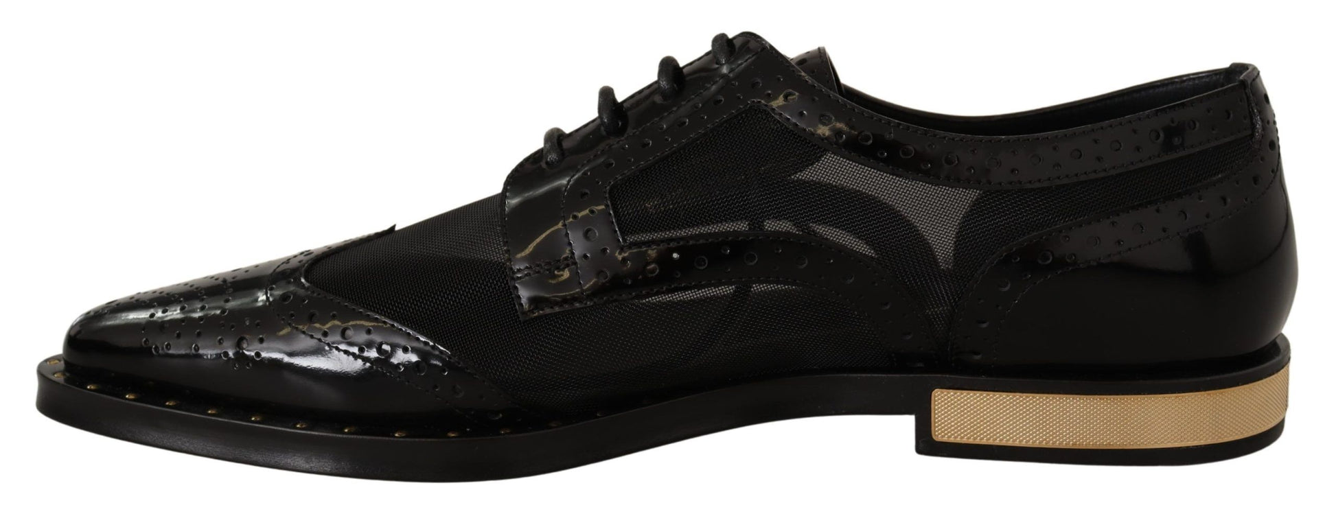 Pair of black dress shoes with gold accents and a patterned design on the side