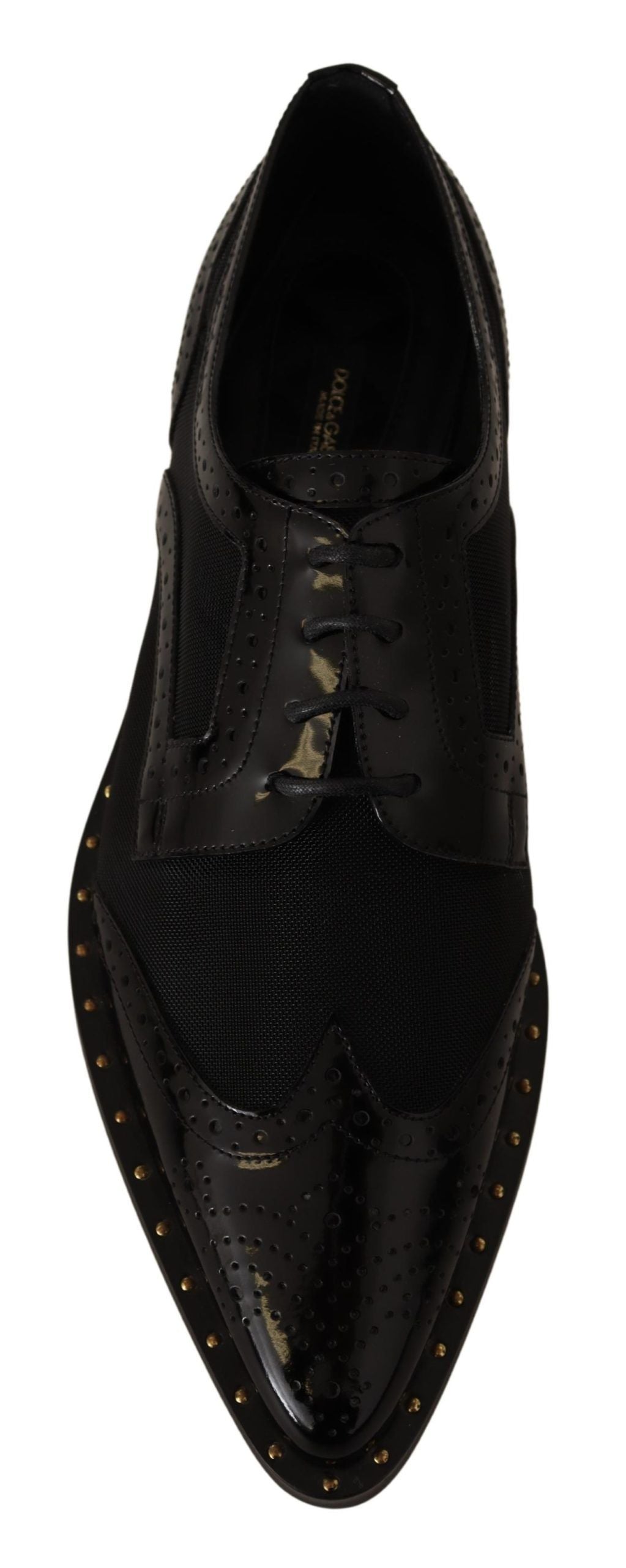 Black dress shoe with laces and gold accents