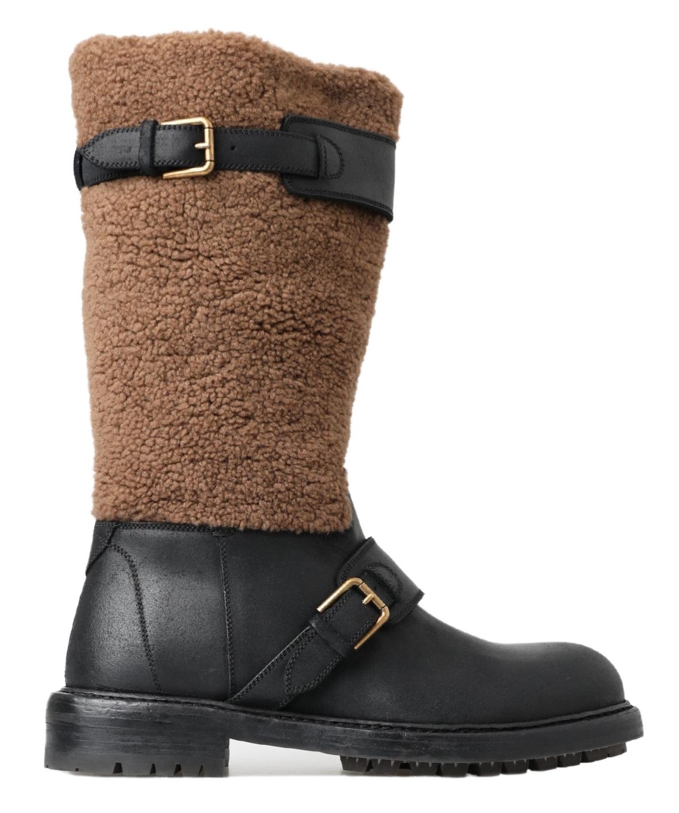 Brown fur lined boot with black leather exterior and gold buckle