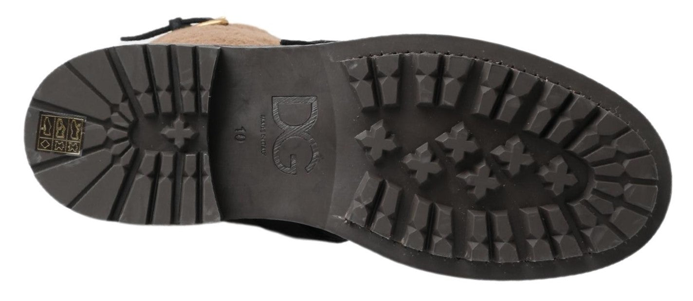 Pair of black work boots with treads on soles