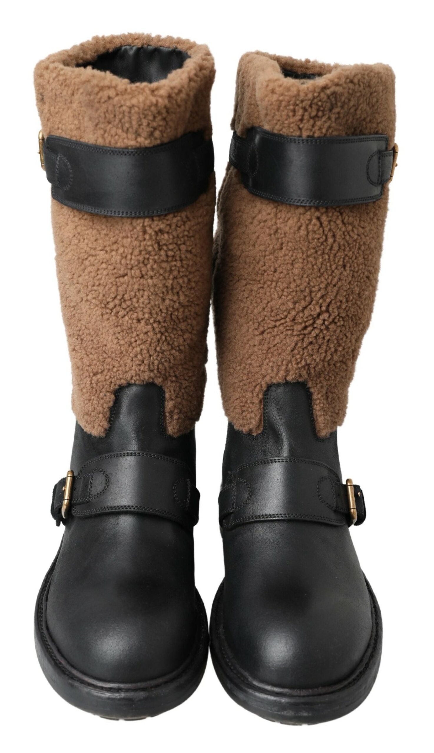 Pair of brown and black boots with straps and buckles