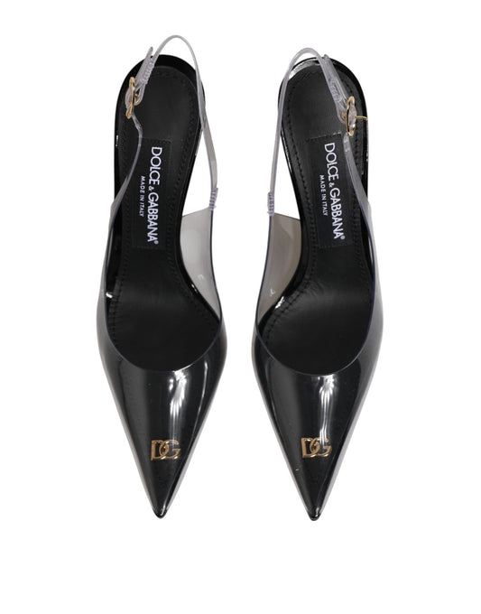 Pair of black high heel shoes with gold accents