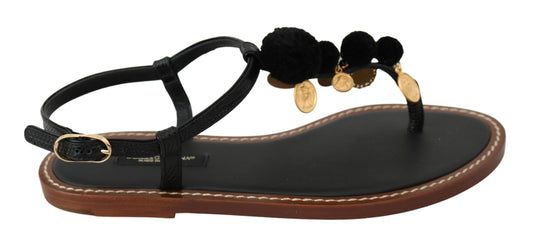 Black sandals with brown straps and black embellishments