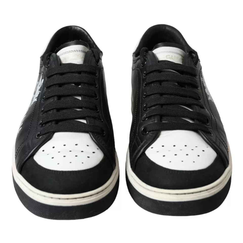 Pair of black leather sneakers with white laces and a white sole, featuring the Dolce & Gabbana logo
