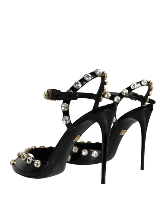 Black high heel shoes with gold accents and clear stones