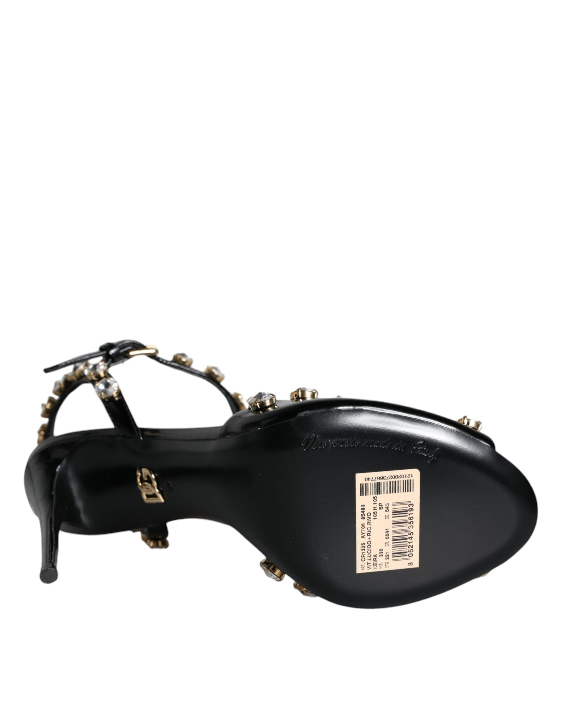 Black shoe with gold buckle