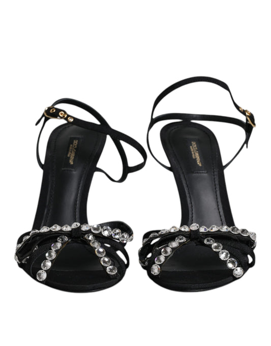 Pair of black high heel shoes with rhinestones on straps