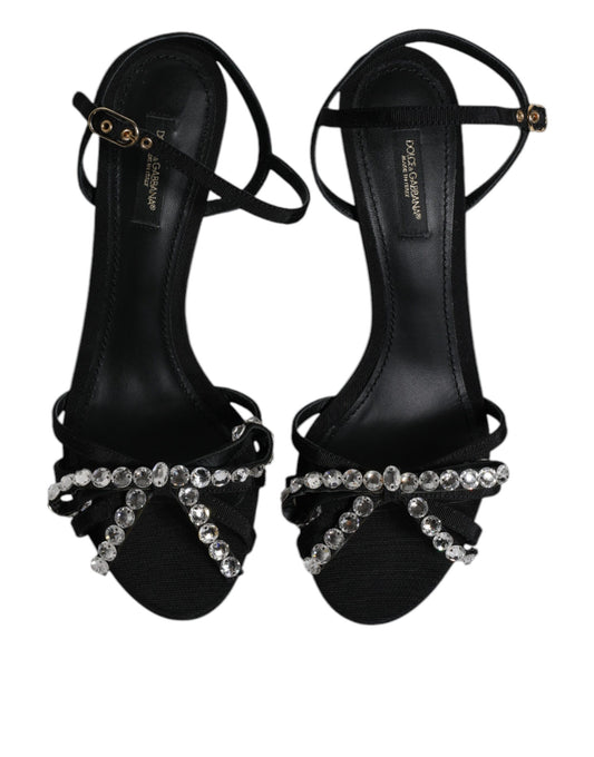 Pair of black high heel shoes with rhinestones on straps