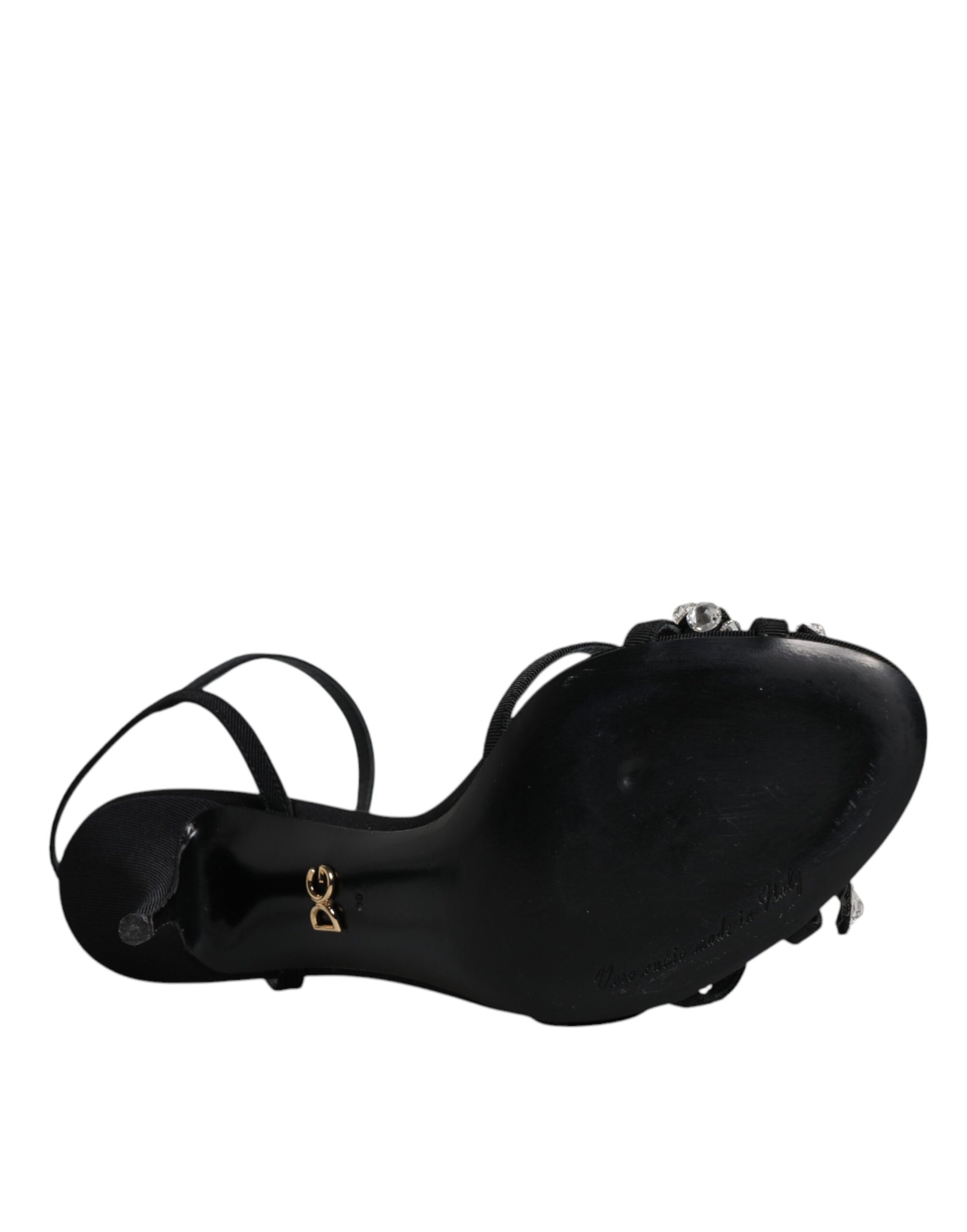 Black shoe with a strap over the top