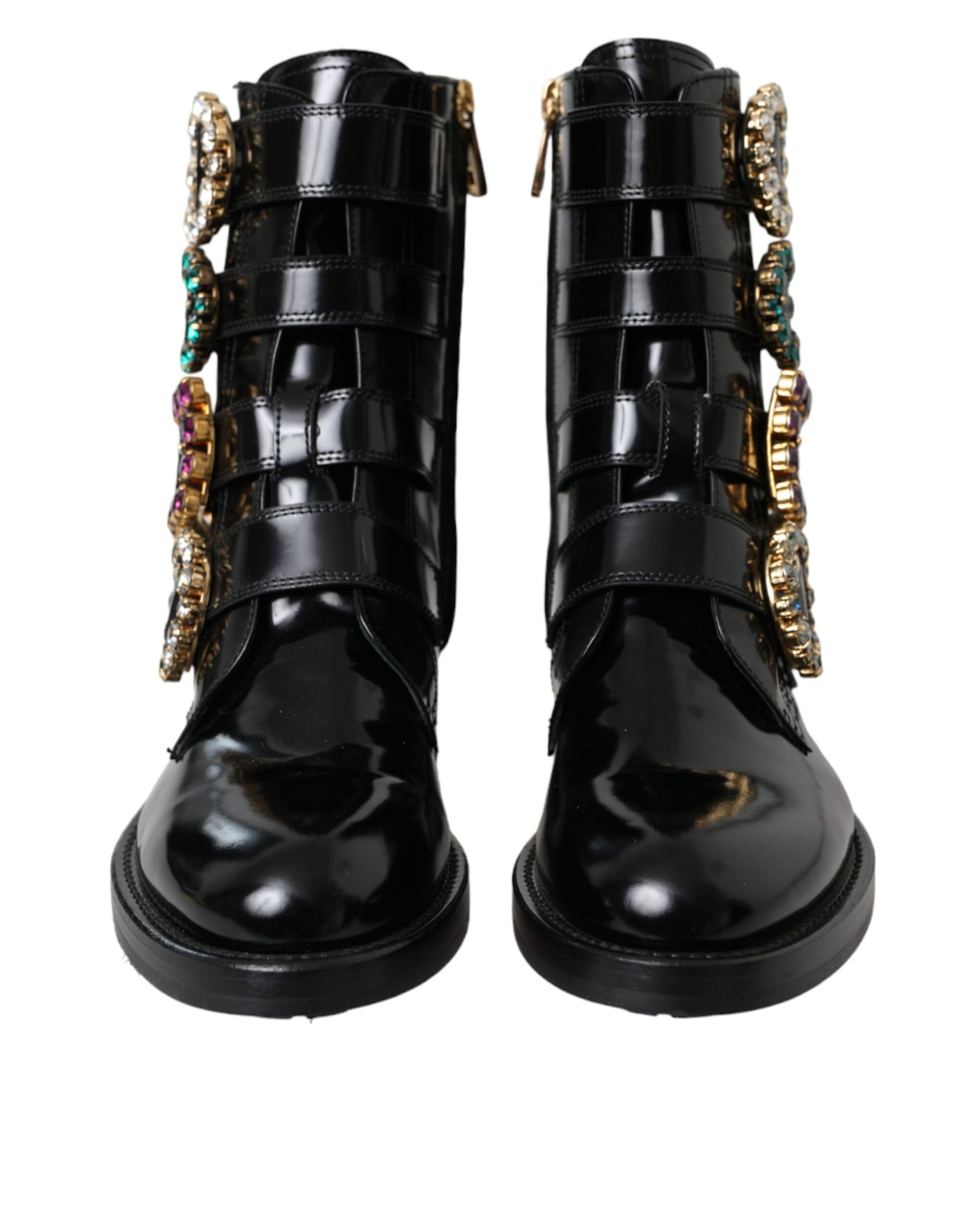 Black leather boots with gold accents and multiple straps