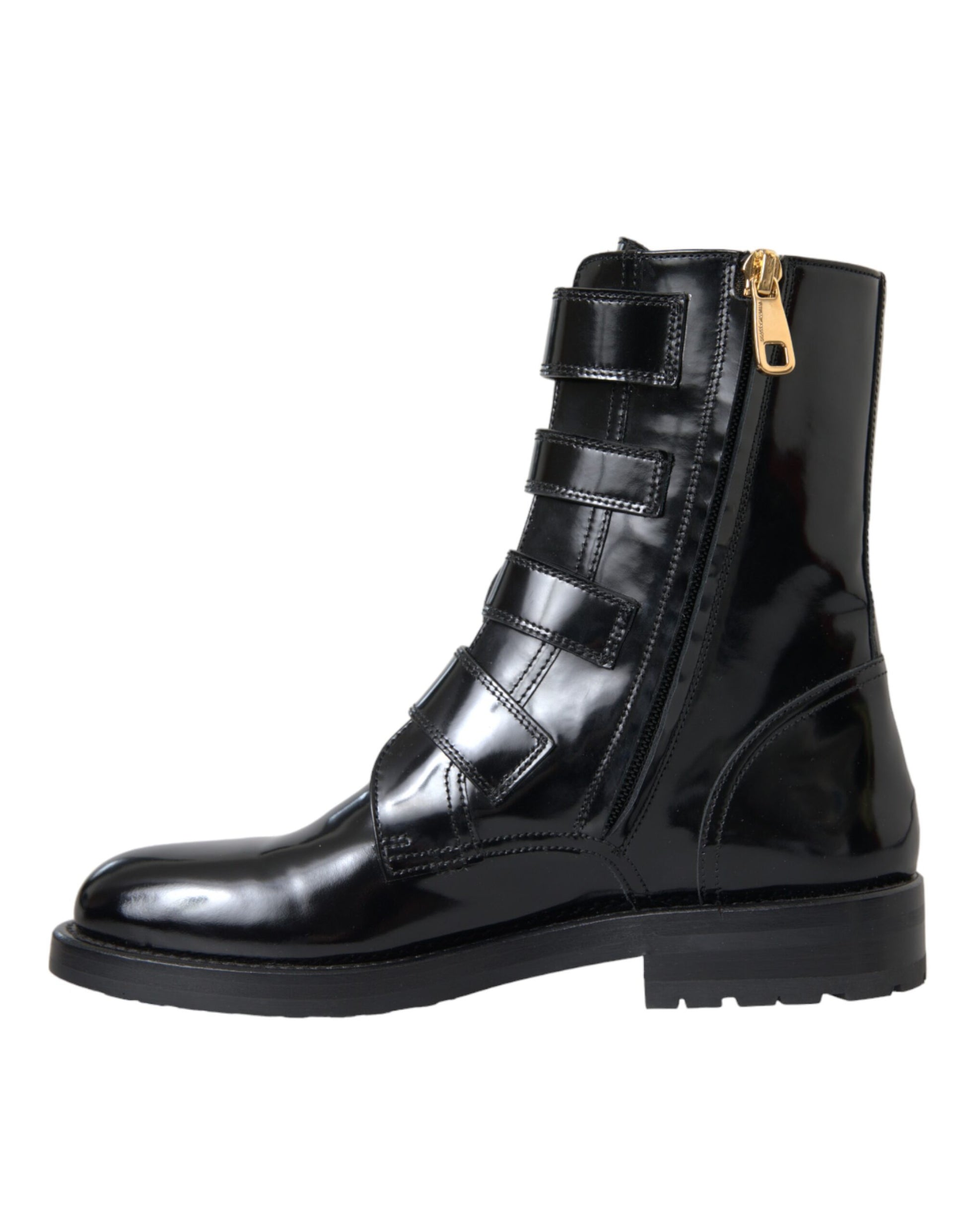 Black leather boot with gold buckle