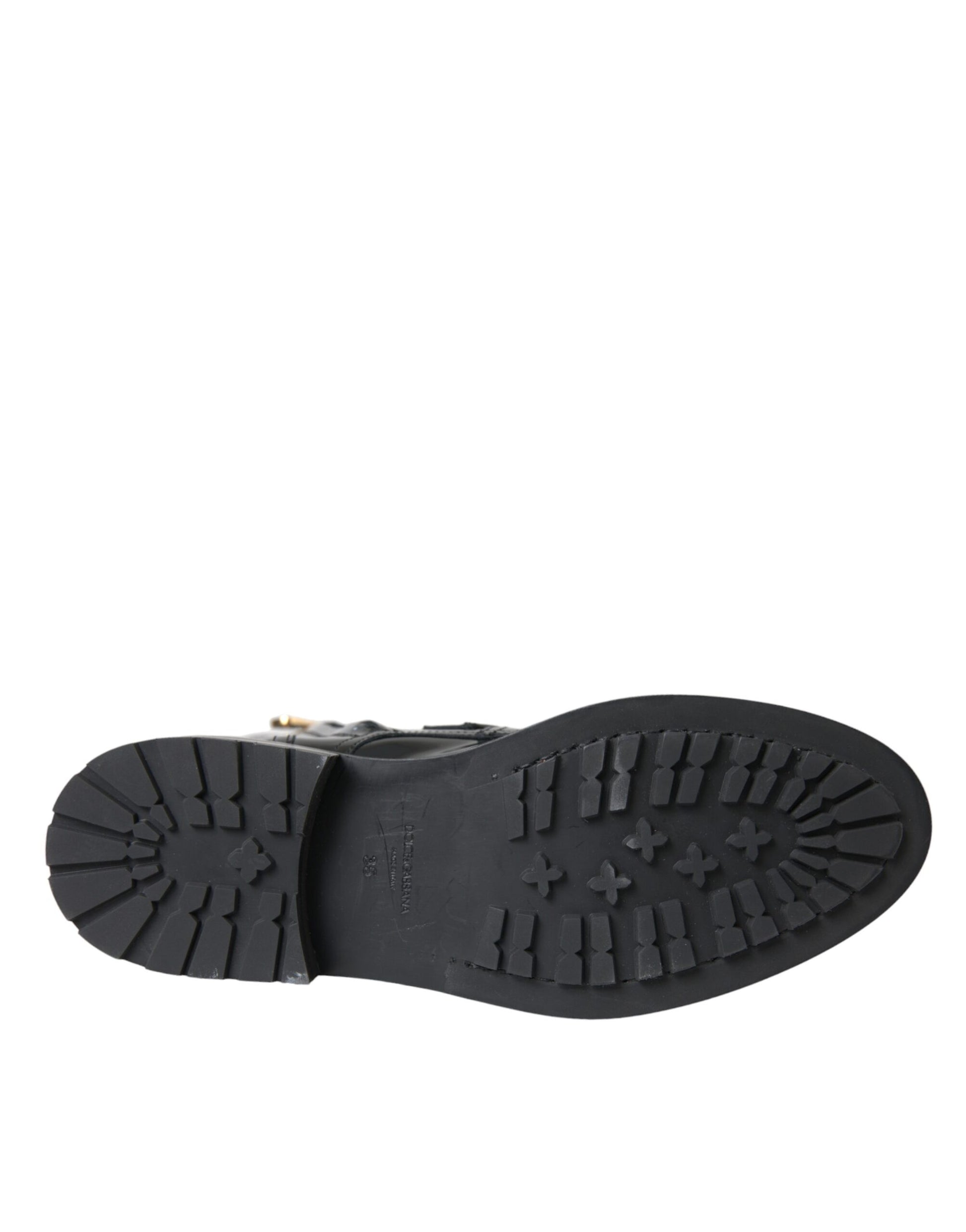 Black rubber boot with deep treads for outdoor use