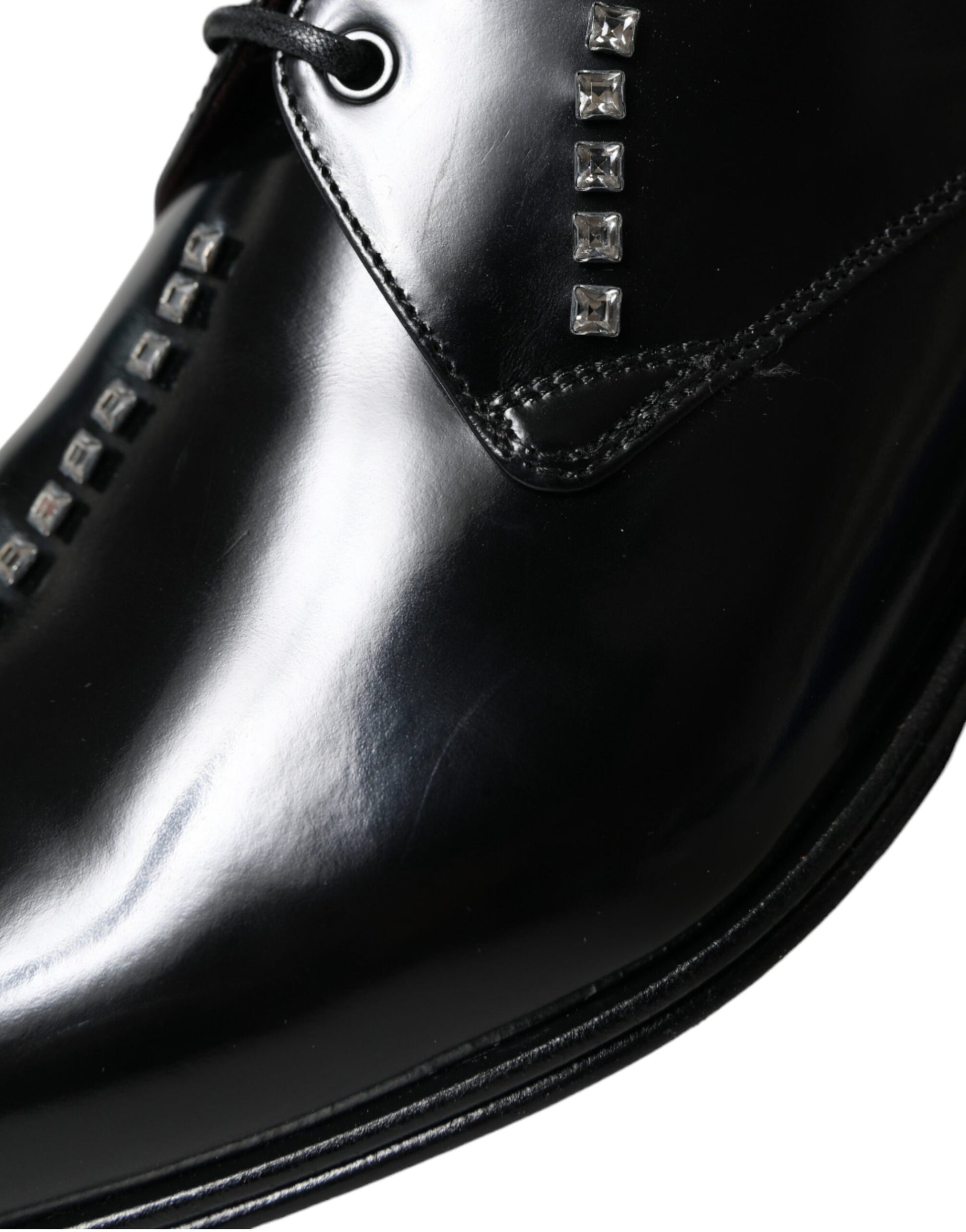 Black leather dress shoe with silver studs on side