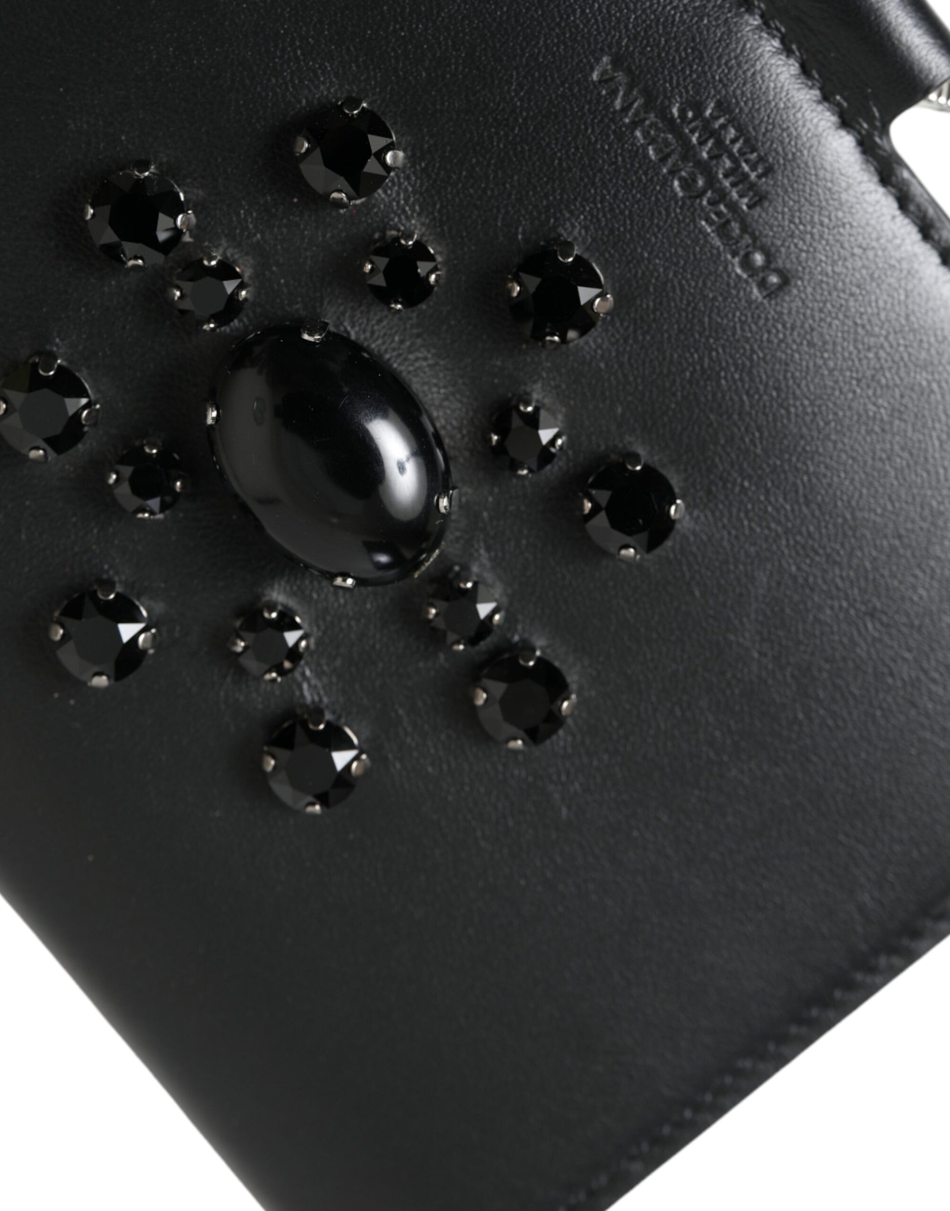 Black leather wallet with embossed logo and crystal accents