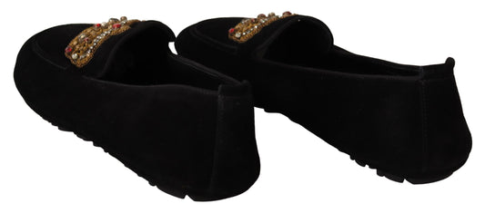 Black shoes with gold embellishments on display
