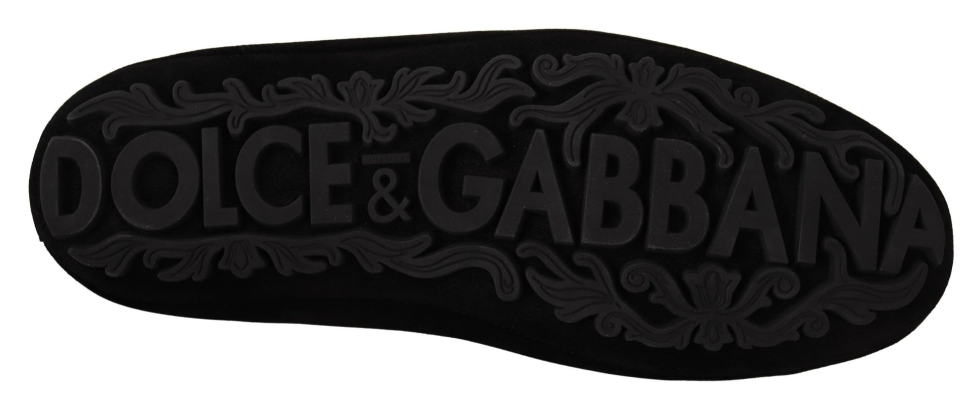 A pair of shoes with the brand name Dolce & Gabbana visible on them